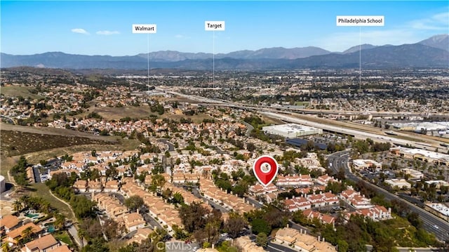 birds eye view of property with a mountain view