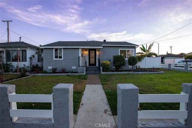 view of front of property with a front lawn