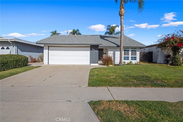 single story home with a front yard and a garage