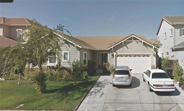 ranch-style home featuring a garage and a front yard