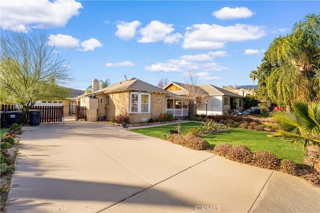 ranch-style house featuring a front lawn