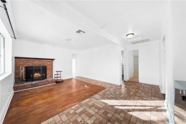 unfurnished living room with a fireplace