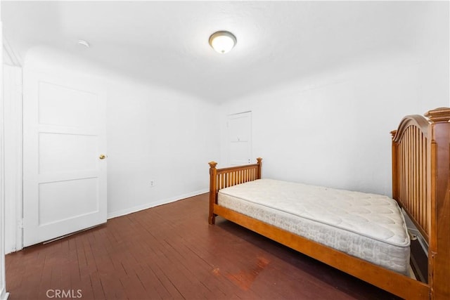 bedroom featuring dark hardwood / wood-style flooring