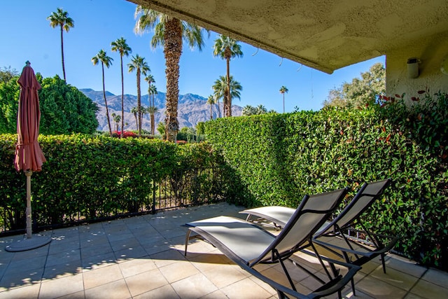 view of patio / terrace featuring a mountain view