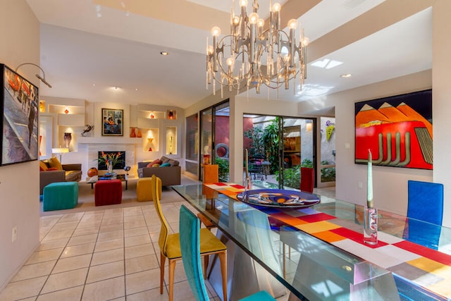 dining area featuring tile patterned floors and a chandelier