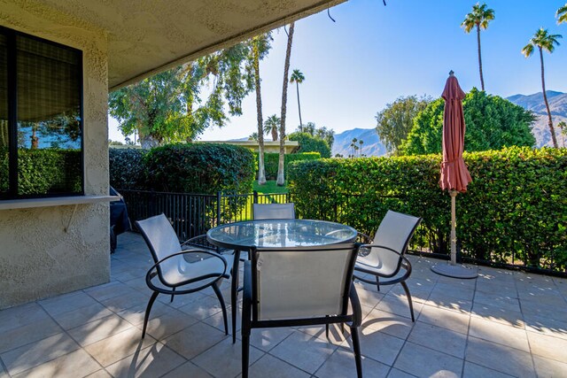 view of patio / terrace with a mountain view