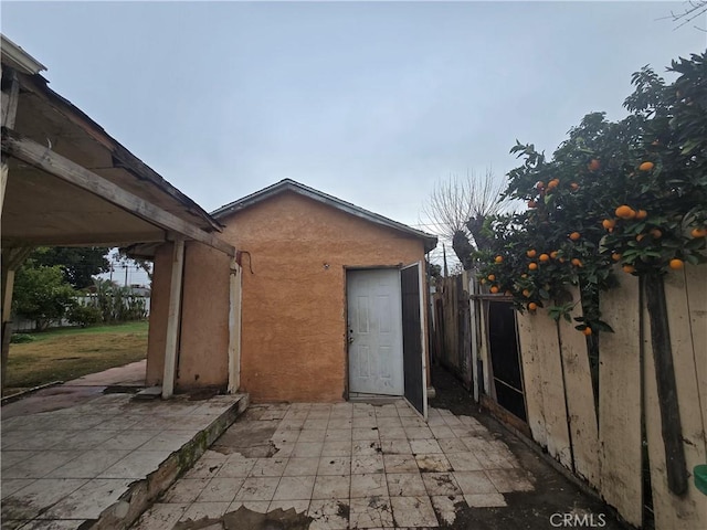 view of side of home featuring a patio area