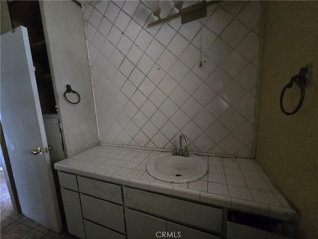 bathroom with vanity and tile patterned flooring