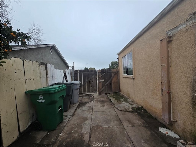 view of side of home featuring a patio area