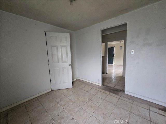 empty room with vaulted ceiling