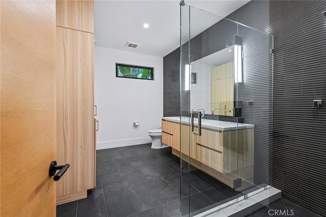 bathroom with toilet, vanity, and walk in shower