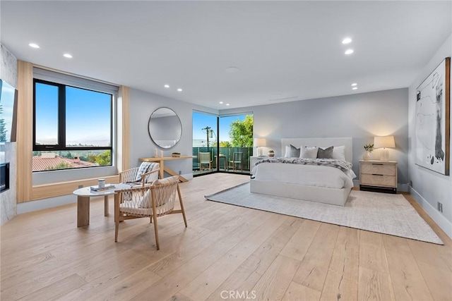 bedroom with light hardwood / wood-style flooring