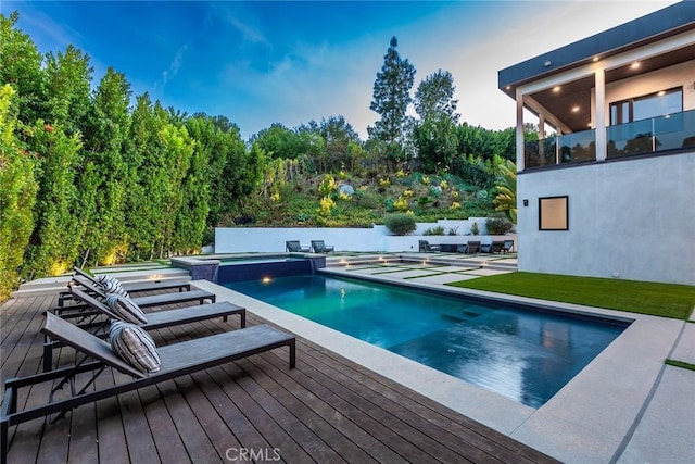 view of pool featuring an in ground hot tub and a patio area