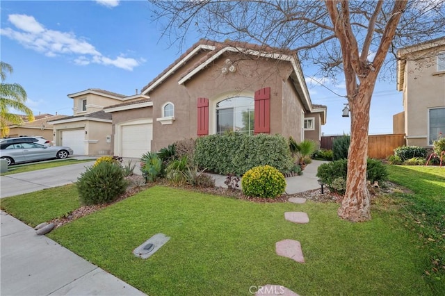 view of front of property with a front lawn and a garage