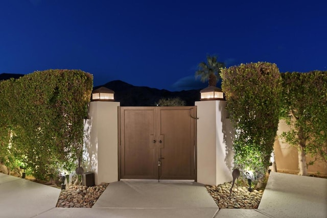 view of gate at night