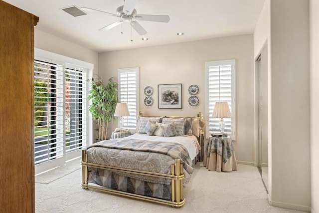 carpeted bedroom featuring access to outside and ceiling fan