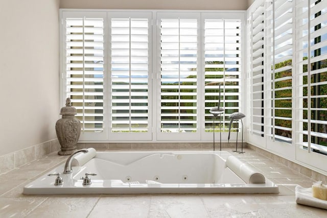 bathroom with tiled tub