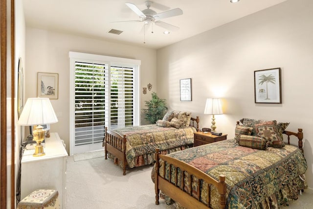 carpeted bedroom featuring ceiling fan