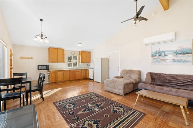 living room featuring high vaulted ceiling, a wall unit AC, light wood-style flooring, and ceiling fan with notable chandelier