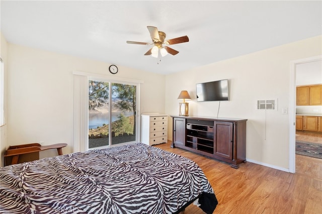 bedroom with visible vents, light wood-style flooring, ceiling fan, access to outside, and baseboards