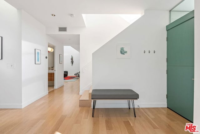 corridor featuring wood-type flooring