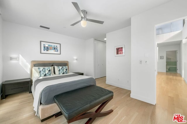 bedroom with ceiling fan and light hardwood / wood-style flooring