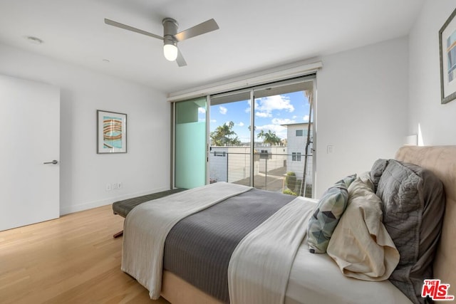 bedroom with ceiling fan, access to exterior, multiple windows, and light hardwood / wood-style floors