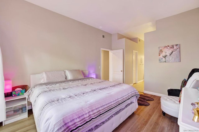 bedroom with light hardwood / wood-style flooring