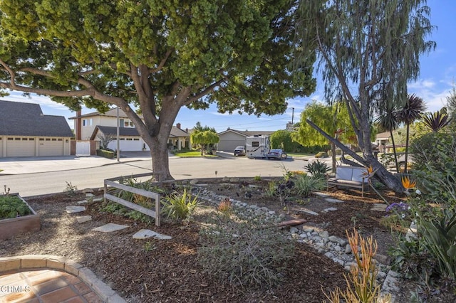 view of yard featuring a garage