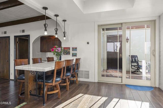 dining room featuring beam ceiling