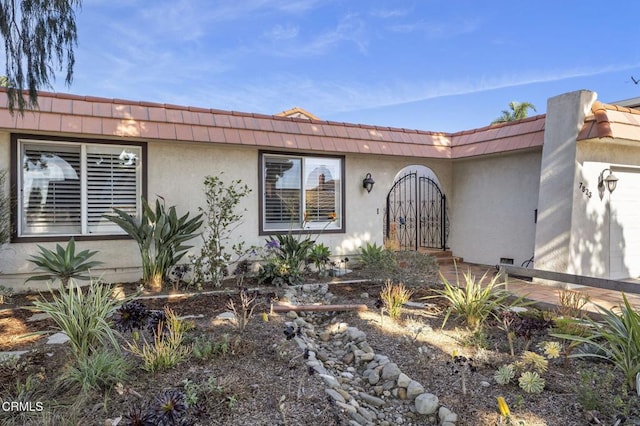 view of exterior entry featuring a garage