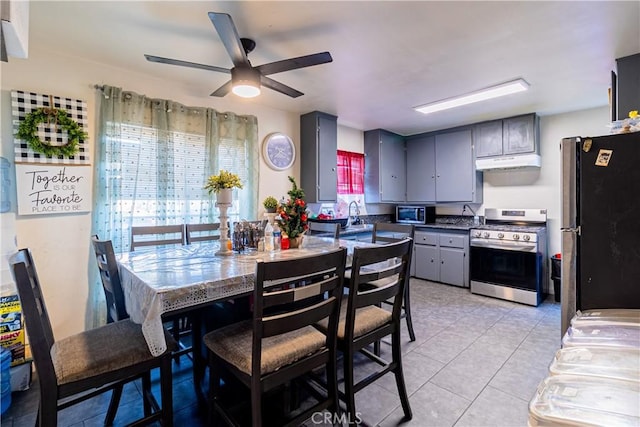 kitchen featuring ceiling fan, sink, light tile patterned flooring, appliances with stainless steel finishes, and gray cabinetry