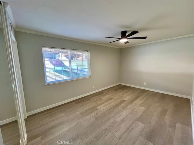 unfurnished room with ceiling fan, ornamental molding, and light hardwood / wood-style floors