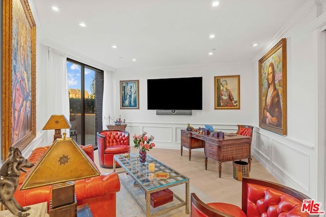 living room with light wood-type flooring and ornamental molding