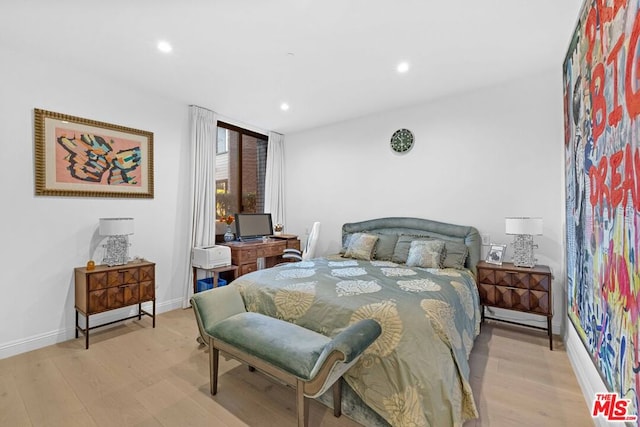 bedroom with light hardwood / wood-style flooring