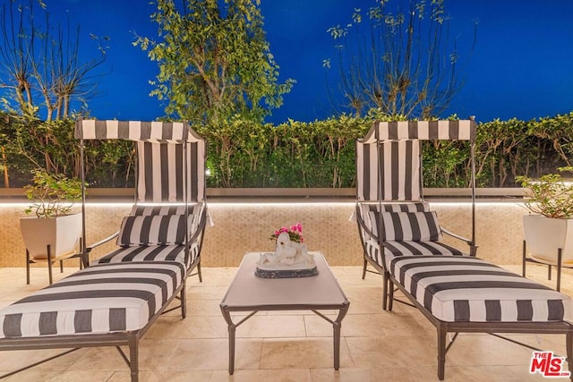 view of patio at twilight