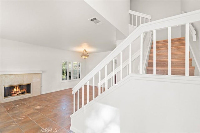 staircase with a fireplace