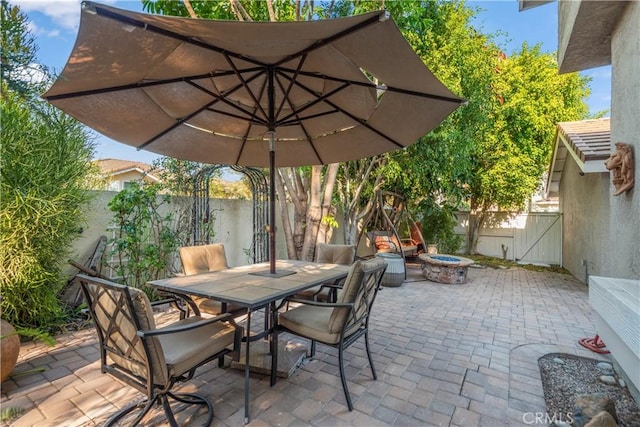 view of patio / terrace featuring a fire pit