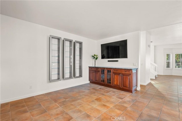 unfurnished living room with light tile patterned floors