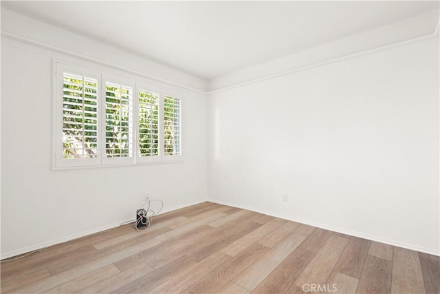 unfurnished room featuring light wood-type flooring