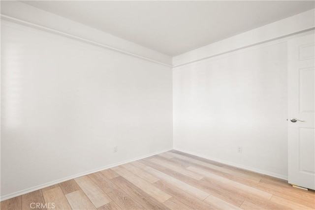 unfurnished room featuring light wood-type flooring