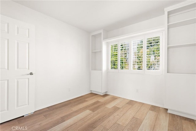 empty room with light wood-type flooring