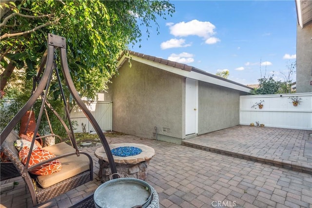 view of patio / terrace featuring a fire pit