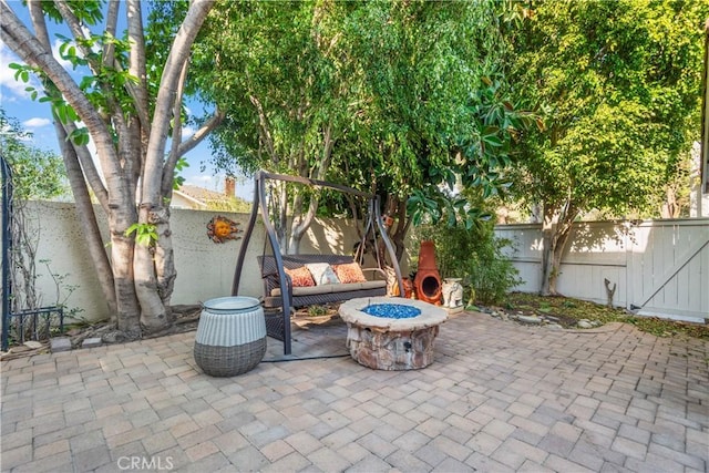 view of patio / terrace with an outdoor fire pit