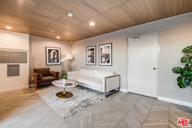 living room with a mail area and parquet floors