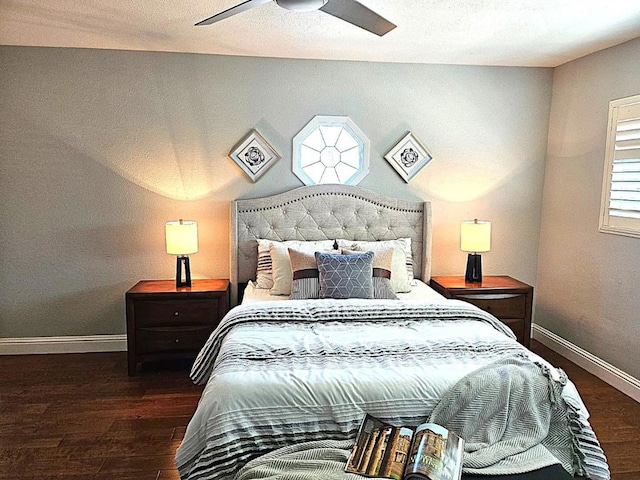 bedroom featuring ceiling fan and dark hardwood / wood-style flooring