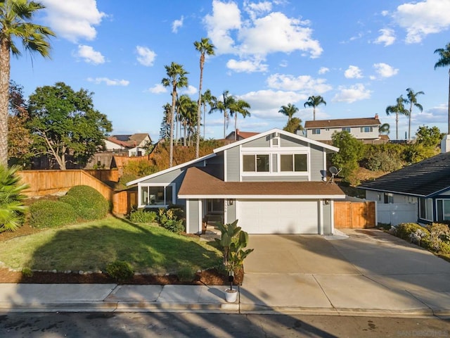 view of front of house with a front yard and a garage