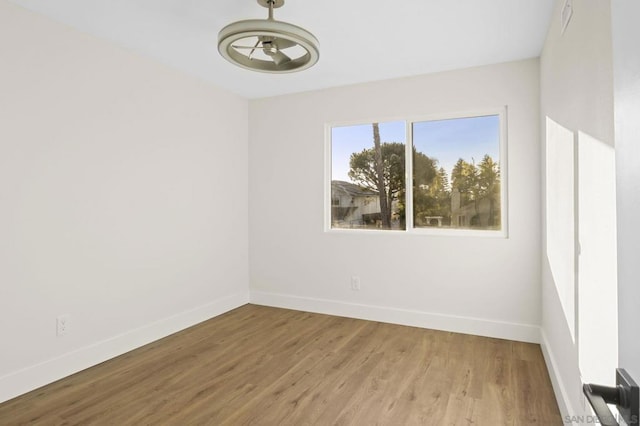 empty room featuring wood-type flooring