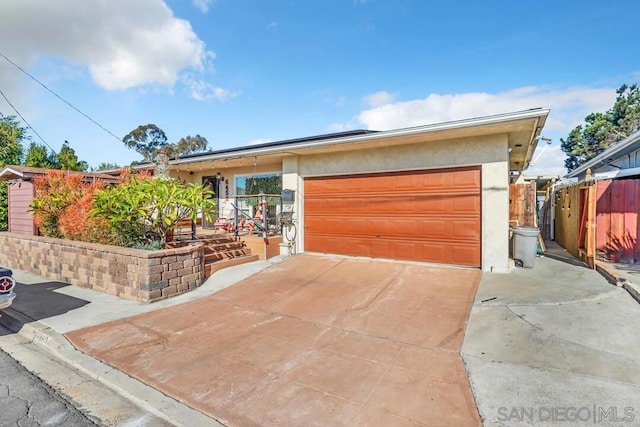 ranch-style house featuring a garage