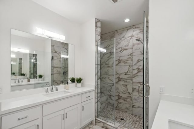 bathroom with vanity and walk in shower